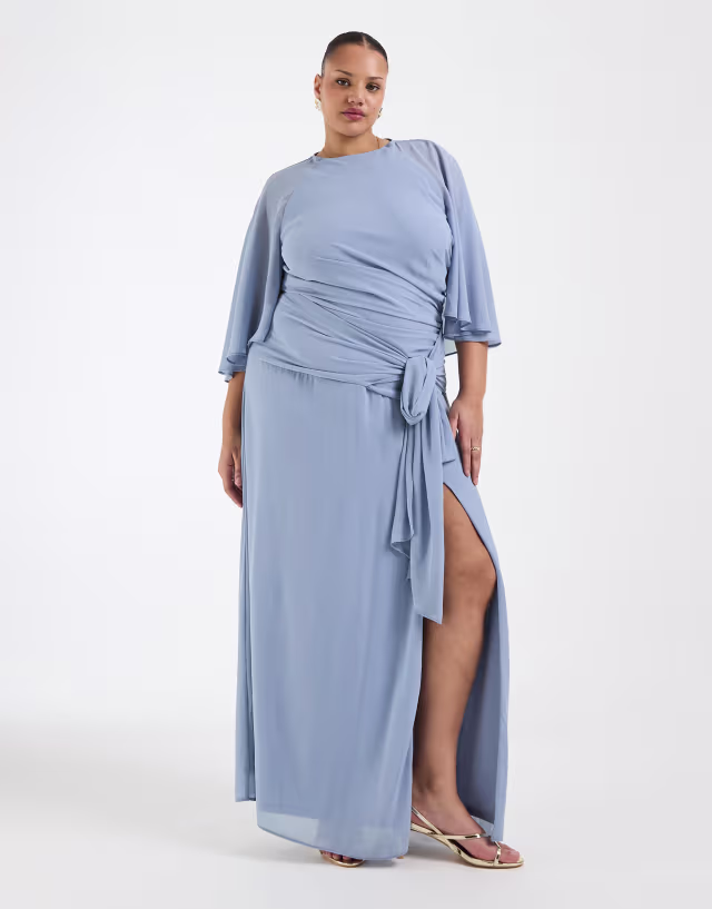 TFNC Plus Bridesmaids chiffon flutter sleeve tie detail thigh slit maxi dress in dusty blue